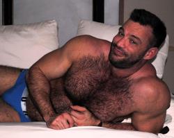 guysthatgetmehard:  hairy fucker aaron cage lounging around in blue briefs  My kind of man - hairy, sexy, handsome and a winning smile