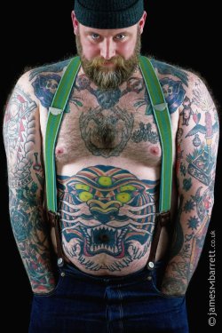 bearsinsuspenders:  bulkmale:  fucking swoon. mr. tony sylvester. sigh.  It’s impressive that his suspenders match his tattoos. Lots of complimentary green. 