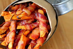 acreatureyoudontknow:  gastrogirl:  bacon-wrapped sweet potato fries.  