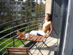 bnekkid83:                                        Nude On A Balcony ; Enjoying the warmth of the morning sun while having her breakfast and reading a good book.Naturally speaking,every morning should begin this way…Agree?? 