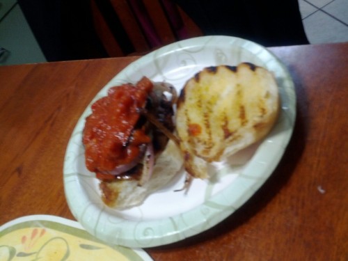 Italian sausage patty, red onion, and fried eggplant, topped with marinara sauce on a bun. Wonderful.