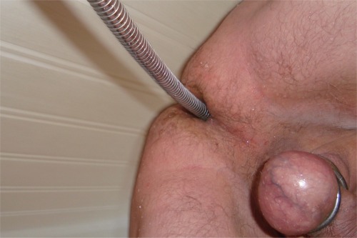 Porn photo enema with the shower pipe