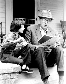 pearlsindiamonds:  Mary Badham and Gregory Peck going revising the script on the set of To Kill A Mockingbird, 1962. 