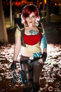 windofthestars:  cosplayed:  Me (WindoftheStars) as Lilith (Borderlands)  Lol. I was just going to post this photo on tumblr, when SURPRISE it was on my dash.  Haha.  Anyways, costume made and worn by me.  Tats and gun by Ice_man. Photo by Darkain. 