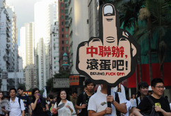 Fifteen years after British colonial rule ended and China regained control of the city, tens of thousands of protesters took to the streets in the annual pro-democracy march. Protesters chanted slogans against new Hong Kong Chief Executive Leung Chun-ying