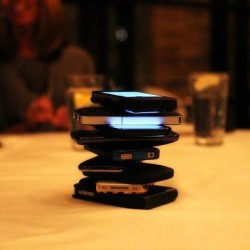 dafuq:  ianthe:  kodakboi:  Everyone puts their phones in the middle of the table. Whoever cracks first by touching their phone, pays for the entire meal. The purpose of the game was to get everyone off their phones, away from twitter, facebook, texting,