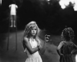 tristetriste:  Candy Cigarette, 1969 by Sally Mann  Sally Mann’s famed body of work Immediate Family documents her three children, Emmett, Jessie and Virginia, in an array of scenes at their home in the foothills of the Blue Ridge Mountains in Virginia.