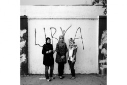 Tripoli, Libya. August 2011.Salma Taghdi, 22, Aseel Tajuri, 22, and Maysam Shebani, 22, created a revolutionary newspaper to provide citizens of Tripoli with daily updates gathered from the radio. Taghdi and her father used a radio to listen in on the