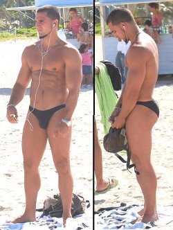 menwearingthongs:  Sexy guy rocking a speedo at the beach.   Hot