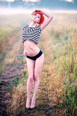 Redhead posing in the fields outdoor.