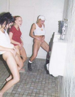 The girls were lively and full of spirit. Drinking alcohol at the adjacent club not only urged them to pee, it also made them merry and bold enough to take off their panties and stand next to each other in the men’s restroom, peeing freely and openly.
