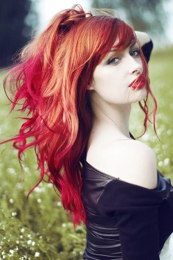 Redhead lipstick. Posing outdoor.