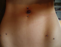 fuckyeah-piercings:  Kate, age 17. appulpie.tumblr.com Shown: Navel, inverse navel, hip/pelvic microdermals x 4  Not shown: Nose, ears Retired: Helix x 2 Pierced at Black Art Tattoo in Quarry Bank, UK. 