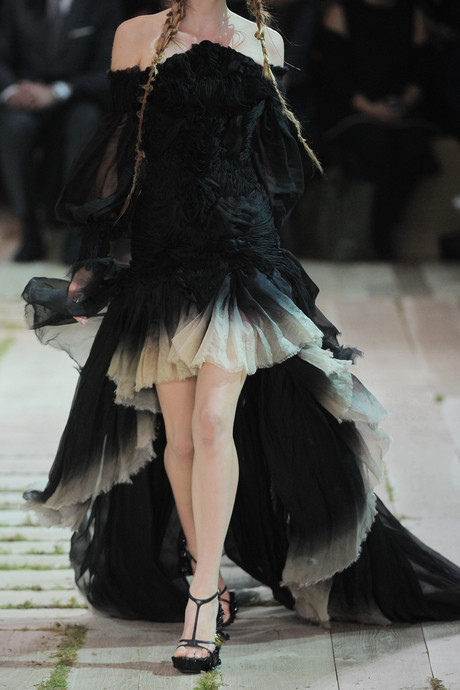 hellomynameisandimaperfectionist:  Alexander McQueen off-the-shoulder gown: black silk-organza, peaked at front of bodice with internal underwired and boned mesh, raw finish, long and loose sheer sleeves, heavily ruched, button-fastening cuffs, dégradé
