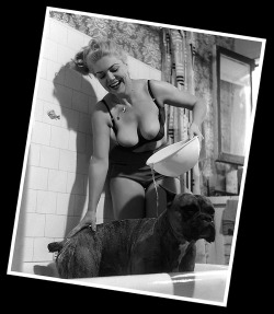 Jennie Lee gives her pet dog (&ldquo;Duke&rdquo;) a bath during this Nudie-Cutie photoshoot intended for “The Bazoomers”  fan club..
