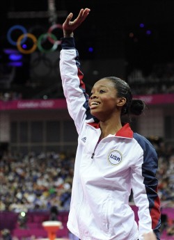 Gabby Douglas reacts to winning Gold in the women’s gymnastics all around. She became the first African-American to win the all around and the third female gymnast in a row to win the medal for the United States.        