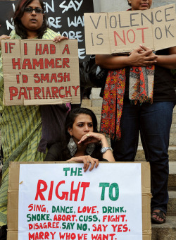 projet-bleu:  Indian activists belonging to various womens rights organisation hold placards during a protest demonstration staged in Bangalore condemning violence against women and transgender people.  