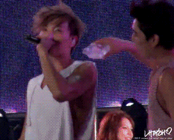 jeongsoo:  Kangin spilling water on Leeteuk and ripping off his shirt. 