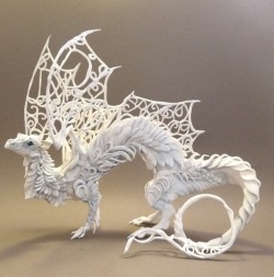 wryer:  Ellen June is an artist from Canada who uses air-drying clay, wire, glaze and acrylic paint to create these amazingly beautiful sculptures of fantasy animals. Each sculpture is handmade and painted with no more tools than fingers and a paint