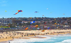 lovecovetdream:  Love: a sky full of rainbow coloured gummy bears Wind god Aeolus blessed Bondi with a beautiful breeze today for the Festival of the Winds mass kite-flying extravaganza.  Bondi Beach, Sydney, Australia 
