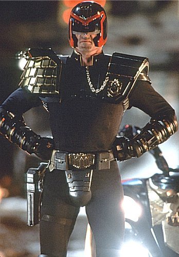 sirdeepcookie:  Live action brings u : Judge Dredd     Dredd must be pals with Duke Nukem. They’re 2 sides of the same coin.
