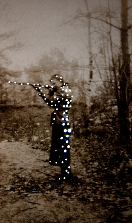 mydarkenedeyes:  Photographer Amy Friend finds vintage images online, in vintage shops or in old family albums and then alters them by allowing tiny holes of light to pass through. The result is an incredibly mesmerizing series called Dare alla Luce,