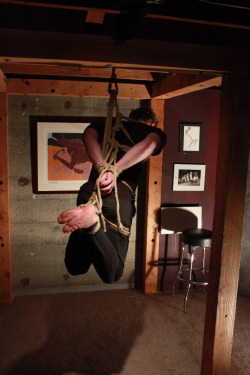 do-not-open-til-christmas:  wannabeabondageguy:  barefootguysroped:  more Seatle Treefort guys- suspended hogties cannot be easy-  Id love to be trussed up like this, just hanging there waiting for master.  This never happened to the pizza guy in the