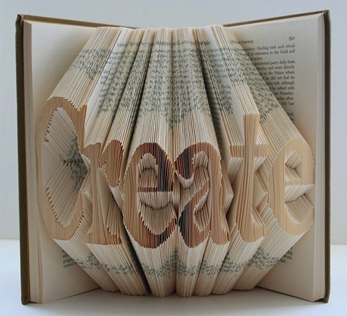 showslow:  Artist Isaac Salazar takes outdated text books and cast-off hardcovers