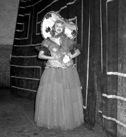   Lynne O’Neill poses backstage in full dance costume, at an unidentified Burlesk theatre..  