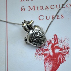 the-absolute-funniest-posts:  The Anatomical Heart Necklace is back in stock at Wicked Clothes! This anatomical heart necklace is so realistic that you’ll almost swear you feel it beating. Even better, this heart can be opened up for a closer look.