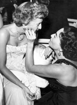 jeanarthur:  Joan Crawford giving her friend Barbara Stanwyck a “chin up” admiration after her recent split from actor Robert Taylor, 1953 
