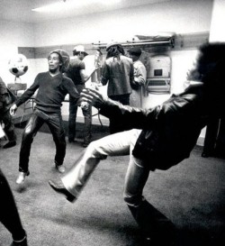  Bob Marley and Jimi Hendrix volley a soccerball.
