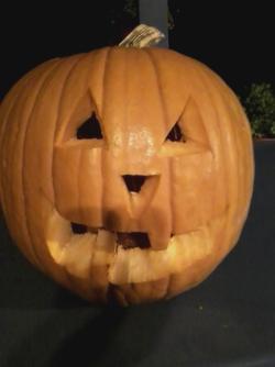 Finally carved my huge ass pumpkin! Now it feels like Halloween