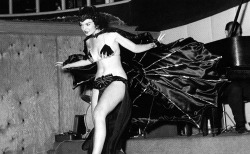 HAPPY HALLOWE'EN! San San performs her &ldquo;Vampire Dance&rdquo; routine at the &lsquo;5 O'Clock Club&rsquo; in Miami.. As photographed by Bunny Yeager..