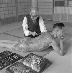 virgineunuchother:  1946, Tokyo, Japan ~ A Japanese tattoo artist works on the shoulder of a Yakuza gang member. ~ Image by © Horace Bristol 