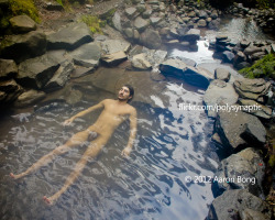 aaronbong:  Cougar Reservoir from Above _DSC4977-16r-watermark-small Alex lies at the edge of the uppermost of four pools in the Cougar Hot Springs located in the Cougar Reservoir. His feet point to the small cave where the spring bubbles up from the