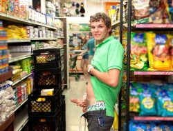This hot young male is showing his engorged cock and balls in the aisle of a store&hellip;with people just a short distance away!